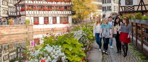 Students walking through garden in Strasbourg, France